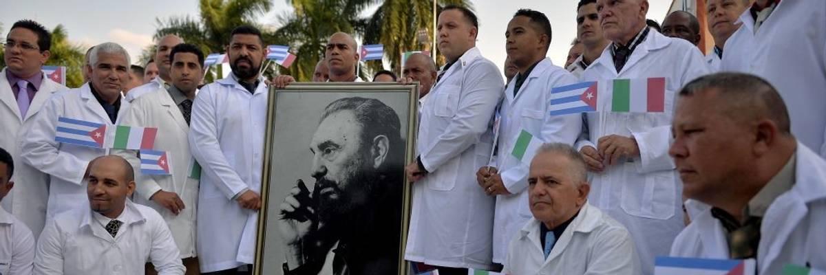 Cuban doctors pose before departure.