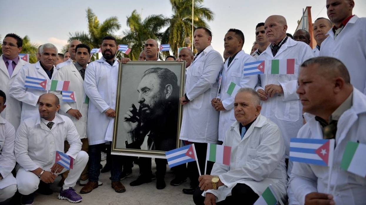 Cuban doctors pose before departure.