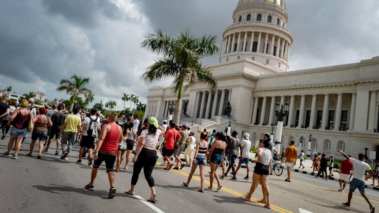 Cubans march in front of the nation's Capitol during a demonstration against the government of Cuban President Miguel Diaz-Canel in Havana, on July 11, 2021. (Photo: Adalberto Roque/AFP via Getty Images)