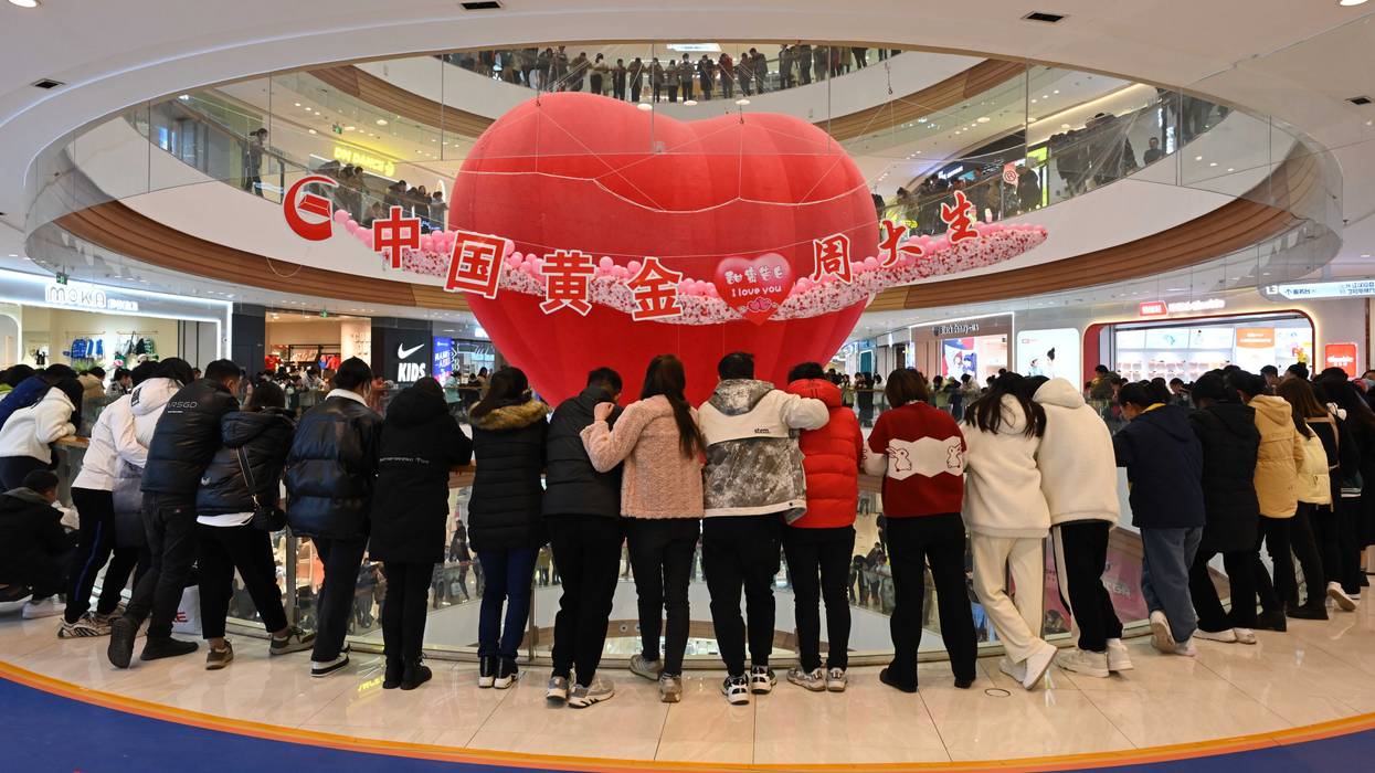 Customers attend a Valentine's Day celebration at a shopping mall on February 14, 2023 in Xiangyang, Hubei Province of China.