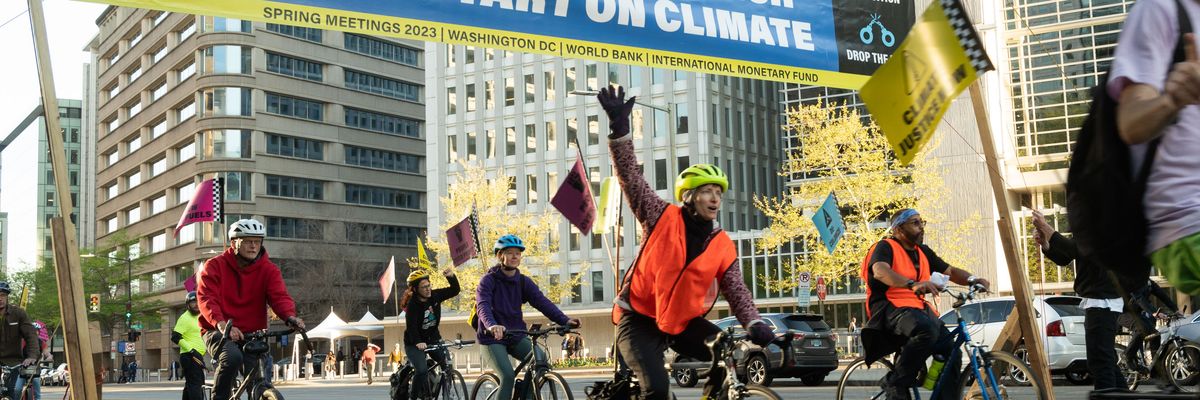 Cyclists take over rush hour traffic outside World Bank headquarters and urge incoming president Ajay Banga to stop funding fossil fuels on April 10, 2023 in Washington, D.C.