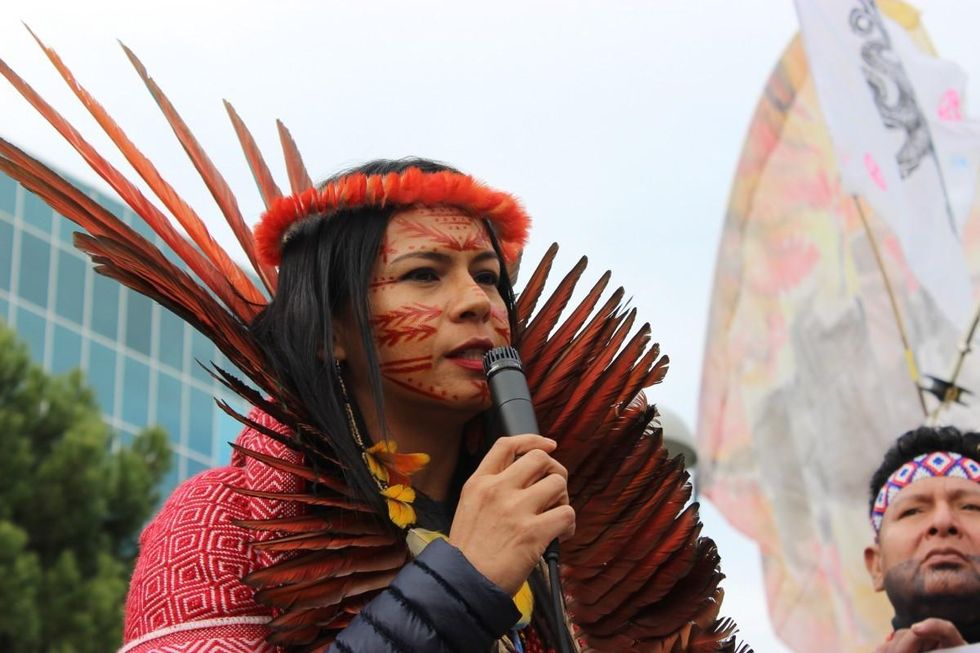 Daiara Tukano speaks at an action coordinated by Indigenous peoples of Brazil days after the killing of two Indigenous leaders in the Brazilian Amazon in December 2019. (Photo: Katherine Quaid/WECAN International)