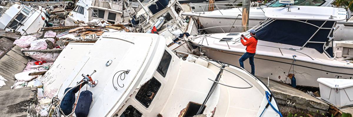 Damaged boats in a pile following Hurricane Ian