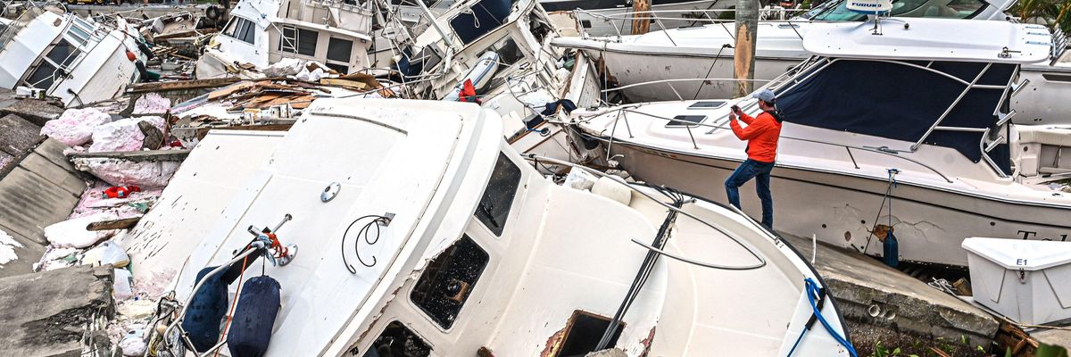 Damaged boats in a pile following Hurricane Ian
