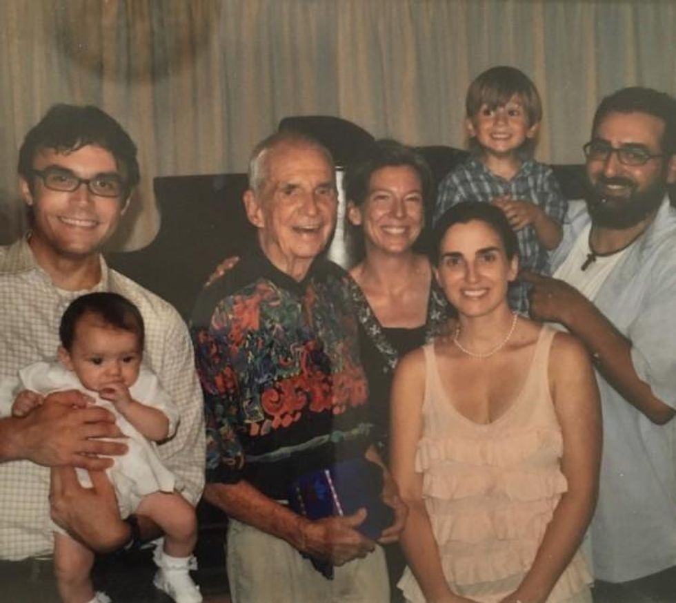 Dan Berrigan at the baptism of Adelina Daloisio, with Matt Vogel, Frida Berrigan, and Amanda, Tobias and Matt Daloisio. (WNV/David McReynolds)