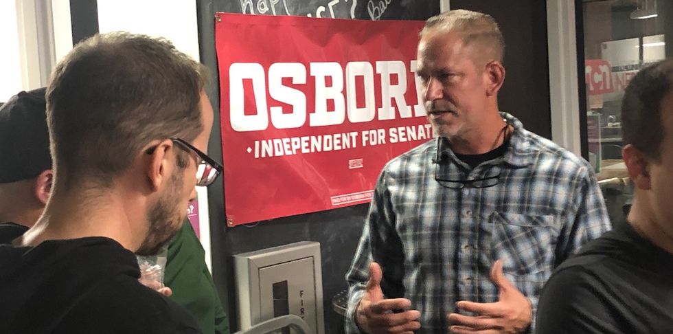 Dan Osborn speaks to supporters.
