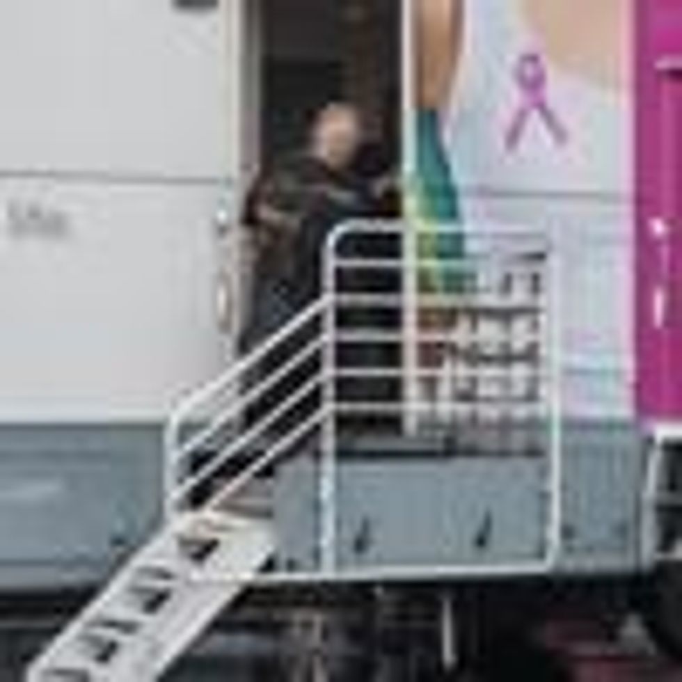 Dawn Dyson leaves a mammography mobile screening bus where free exams were performed in Anaheim, California on October 17, 2016.