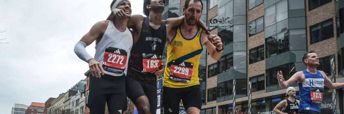 De Oliveira and Beggs help Ajay Haridasse finish the Boston Marathon