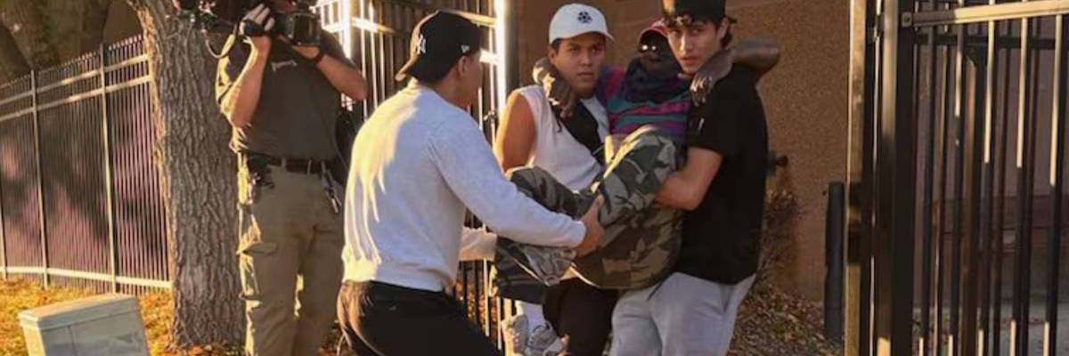 Deeply decent ICE detainees carry Rev. Nalwamba to car