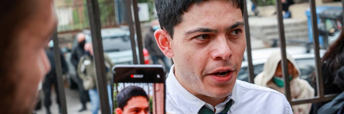 Defendant Sean Binder from Germany answers journalists' questions outside the court of Mytilene on the island of Lesbos on November 18, 2021.