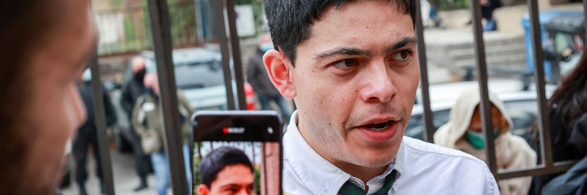 Defendant Sean Binder from Germany answers journalists' questions outside the court of Mytilene on the island of Lesbos on November 18, 2021.