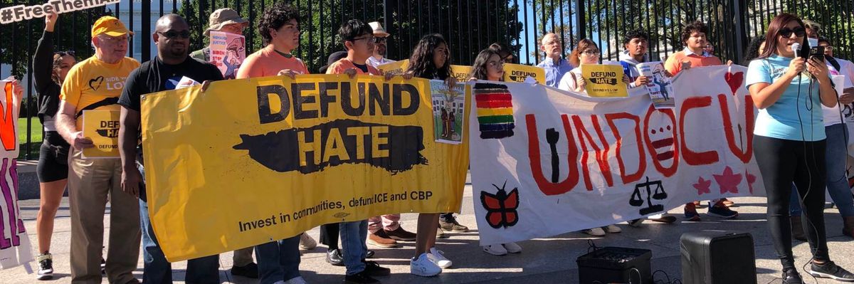 Defund Hate migrant protest White House 