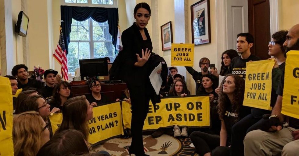 Democratic Congresswoman-elect Alexandria Ocasio-Cortez of New York joined climate activists occupying the office of Nancy Pelosi, who is expected to serve as the next speaker of the House. (Photo: Waleed Shahid/Twitter)