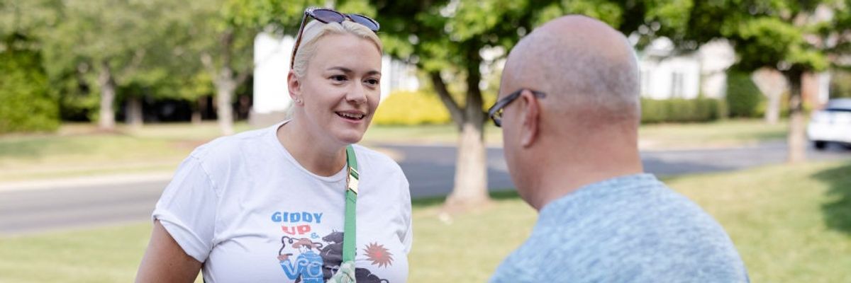Democratic North Carolina state Senate candidate Kate Barr speaks to a voter