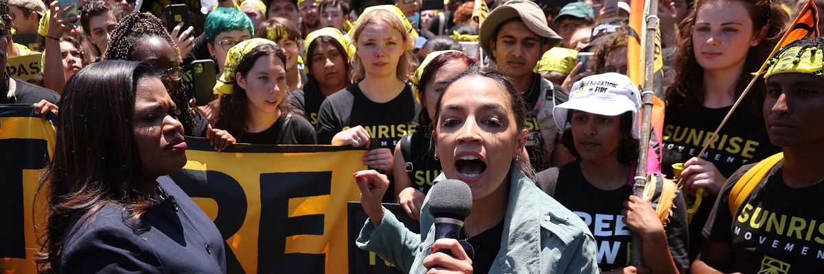 Democratic Reps. Cori Bush (Mo.) and Alexandria Ocasio-Cortez (N.Y.) join hundreds of young Sunrise Movement activists at a 'No Climate, No Deal' rally to demand that President Joe Biden support an "infrastructure package that truly invests in job creation and acts to combat the climate crisis," on June 28, 2021 in Washington, D.C. (Photo: Chip Somodevilla via Getty Images)
