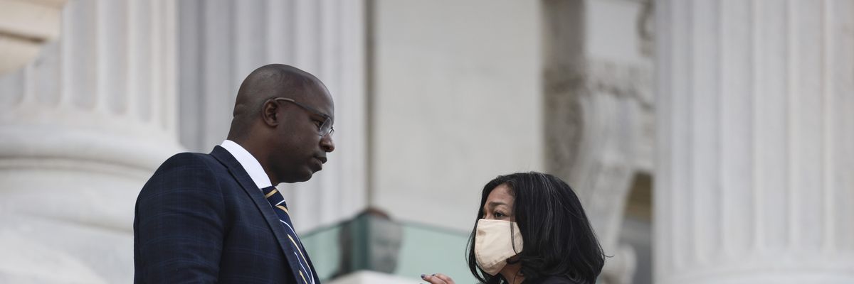 Democratic Reps. Jamaal Bowman (N.Y.) and Pramila Jayapal (Wash.) speak to one another on the steps to the U.S. Capitol on September 23, 2021 in Washington, D.C.