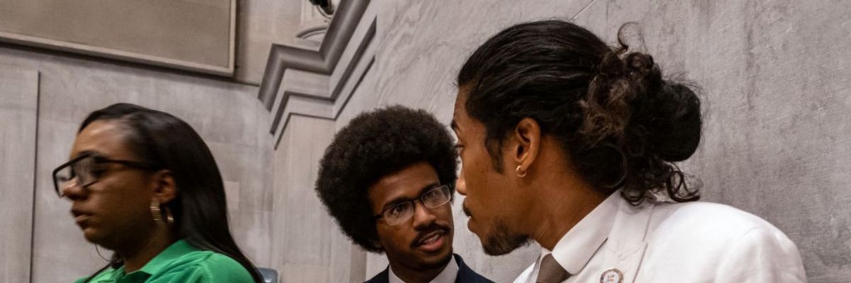 Democratic Tennessee Reps. Justin Pearson (center) and Justin Jones (right) attend the vote in which they were expelled from the state Legislature on April 6, 2023 in Nashville.
