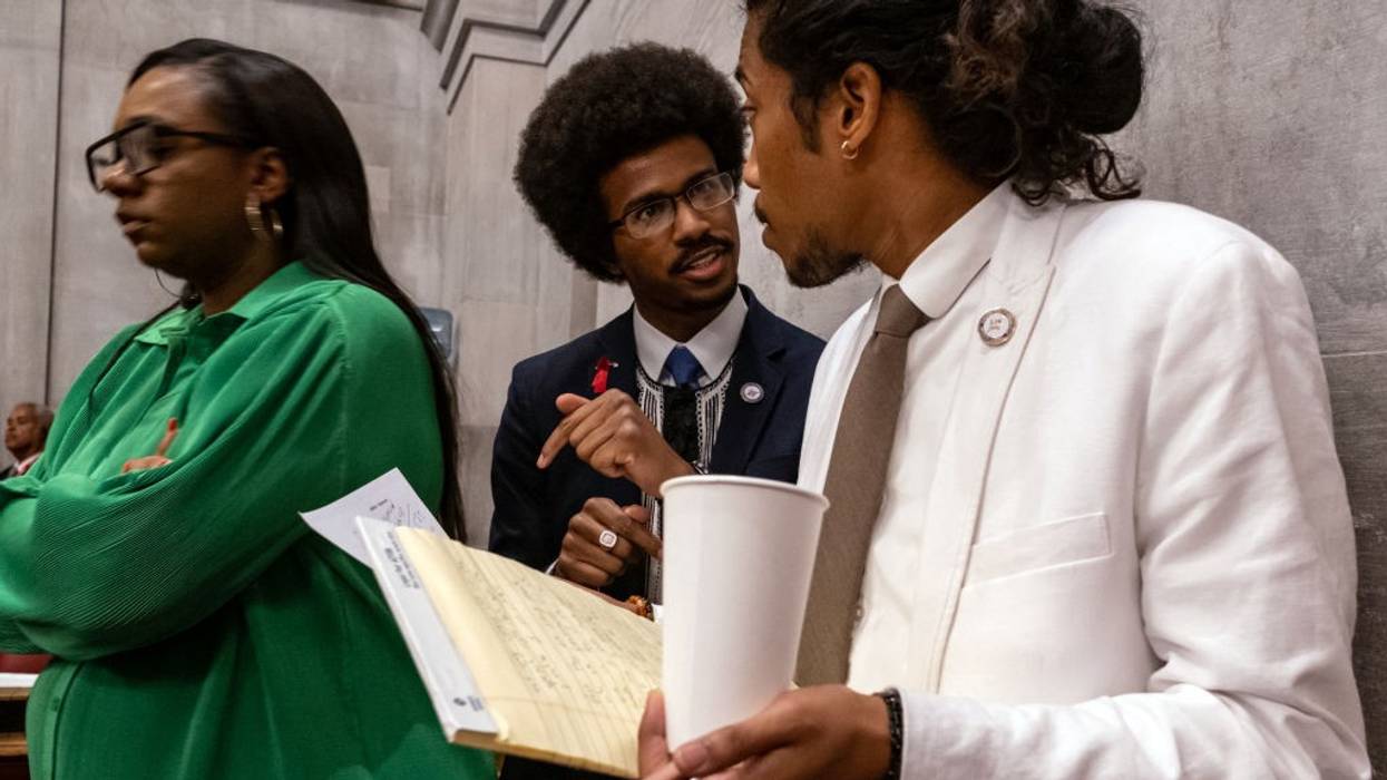 Democratic Tennessee Reps. Justin Pearson (center) and Justin Jones (right) attend the vote in which they were expelled from the state Legislature on April 6, 2023 in Nashville.