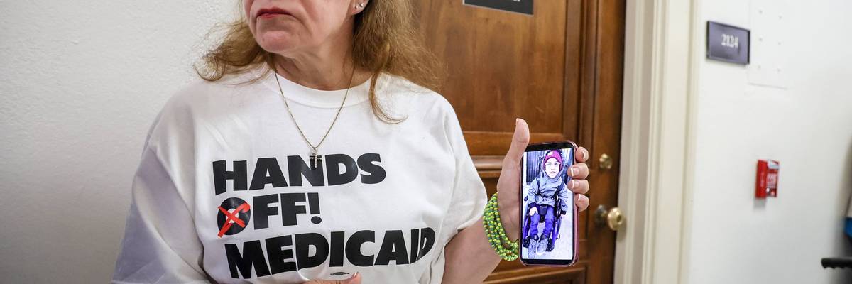 Demonstrator protesting Republican Medicaid cuts