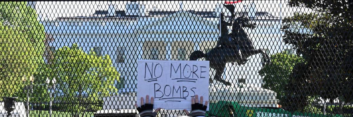 Demonstrator protests Trump wars