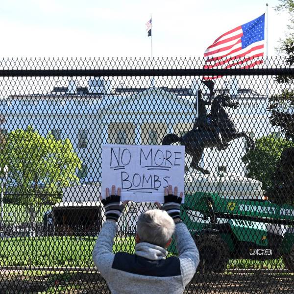 Demonstrator protests Trump wars