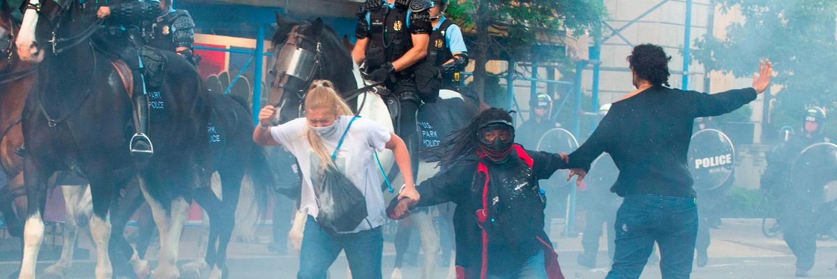 Demonstrators are tear gassed at a protest against the killing of George Floyd