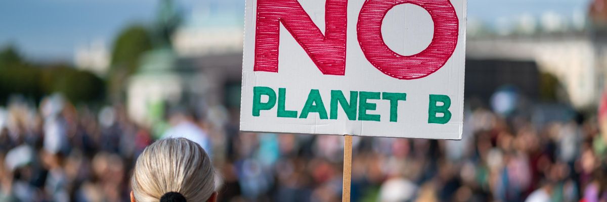 Demonstrators attend a protest demanding climate action