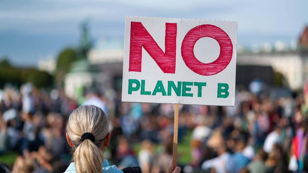 Demonstrators attend a protest demanding climate action