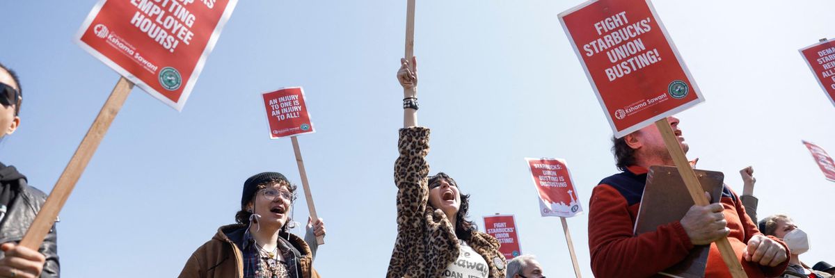 Demonstrators attend a rally against Starbucks union-busting