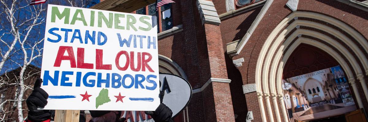 Demonstrators attend a rally in Lewiston, Maine