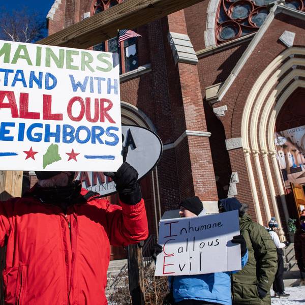 Demonstrators attend a rally in Lewiston, Maine