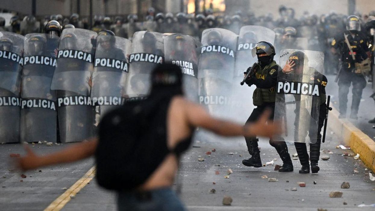 Demonstrators clash with riot police in Peru