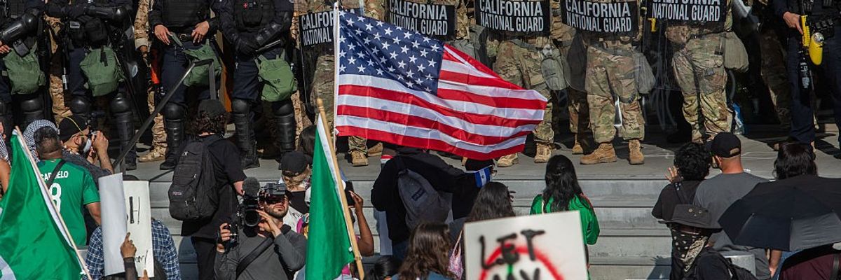Demonstrators face National Guard in LA.