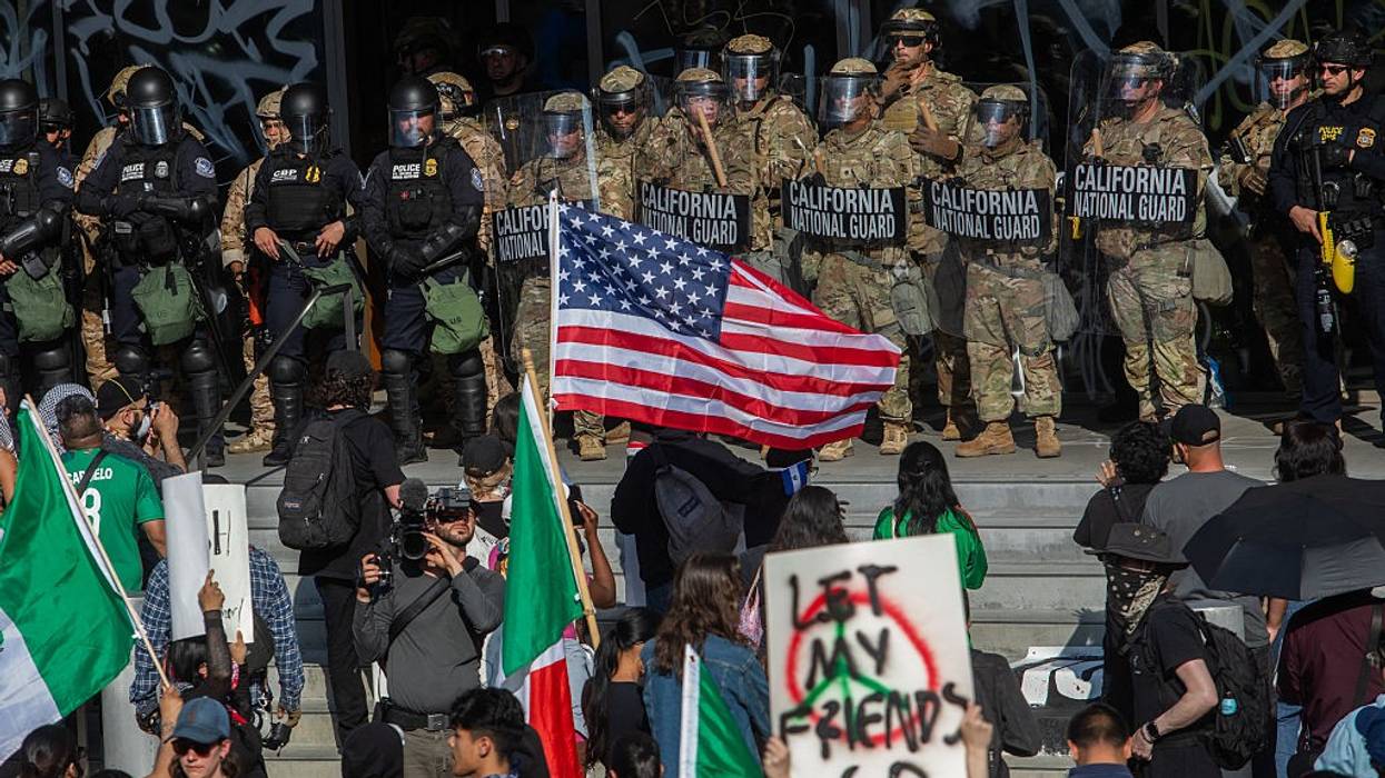 Demonstrators face National Guard in LA.