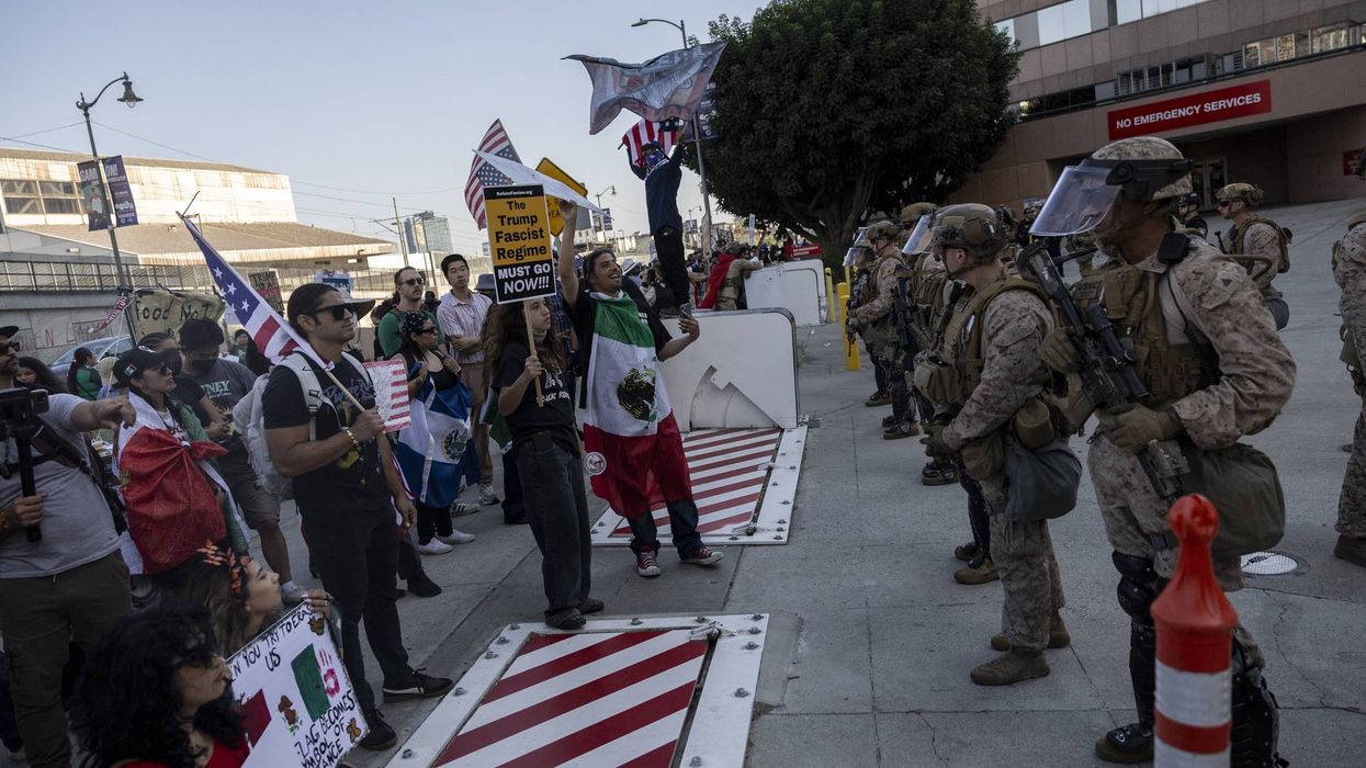 Demonstrators face US Marines, National Guard members, and Department of Homeland Security officers