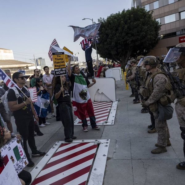 Demonstrators face US Marines, National Guard members, and Department of Homeland Security officers