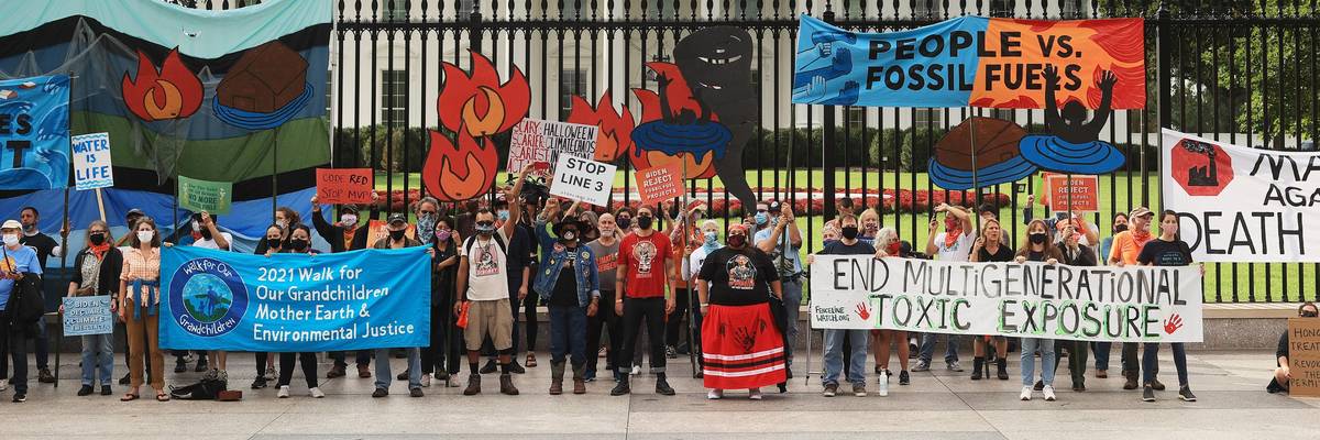 Demonstrators gather for a climate protest outside of the White House