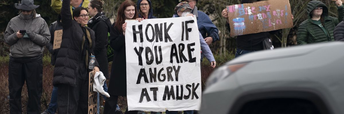 Demonstrators gather for a protest against Elon Musk