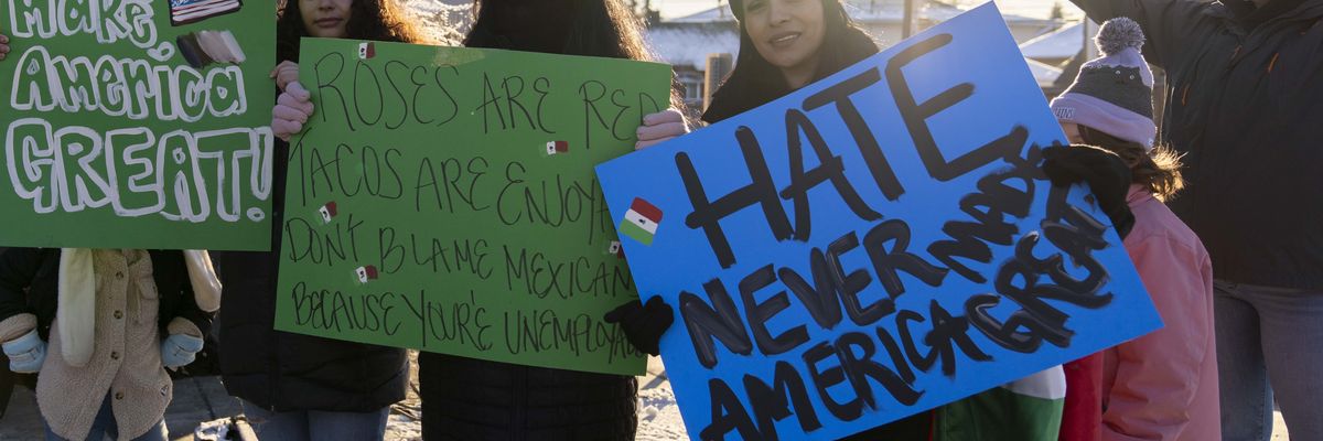 Demonstrators gather outside the U.S. Department of Homeland Security building