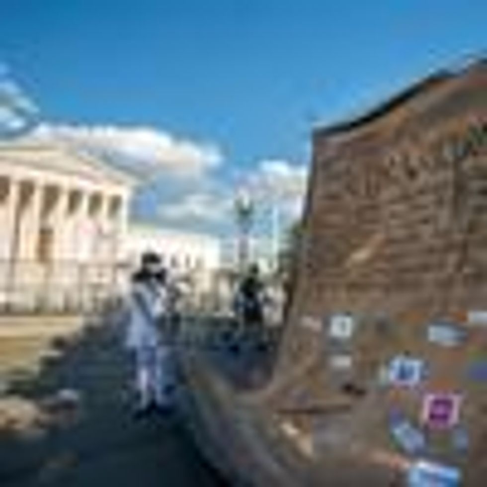 Demonstrators hold a mock Constitution outside the U.S. Supreme Court