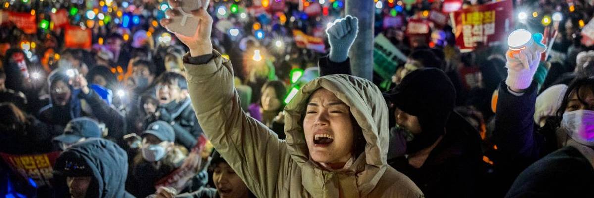 Demonstrators in South Korea protest president.