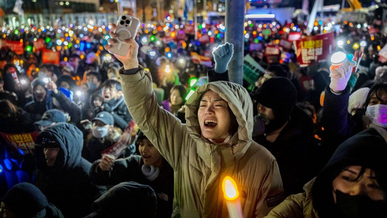 Demonstrators in South Korea protest president.