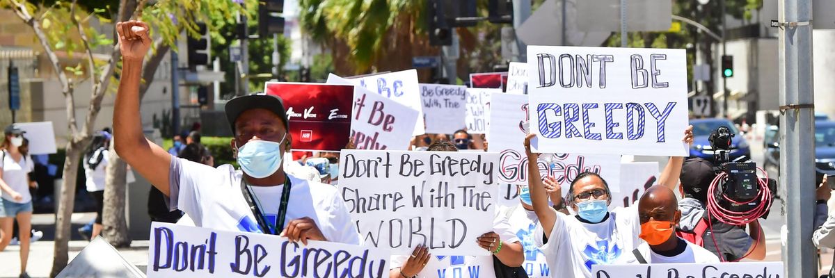 Demonstrators march against vaccine inequity