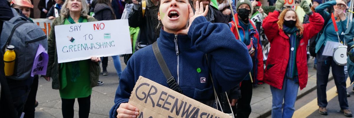 Demonstrators march down Hope Street in Glasgow, Scotland, on November 3, 2021 for a march against greenwashing organized by Extinction Rebellion during COP26.