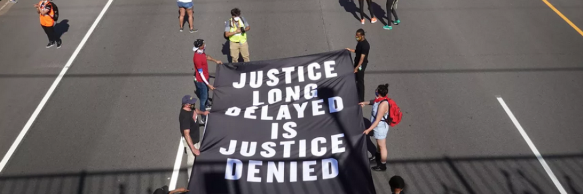 Demonstrators march down I-94 in St. Paul, Minnesota on May 31 during a protest over the death in police custody of George Floyd.