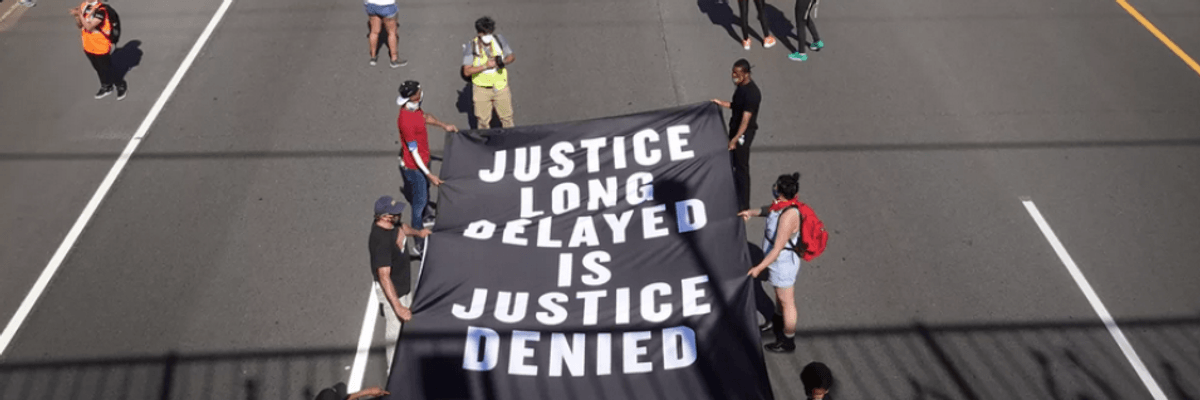 Demonstrators march down I-94 in St. Paul, Minnesota on May 31 during a protest over the death in police custody of George Floyd.