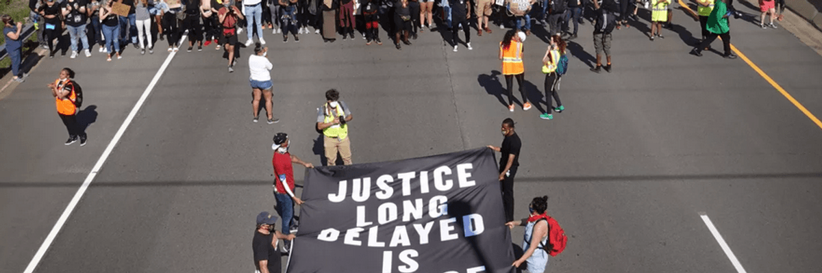 Demonstrators march down I-94 in St. Paul, Minnesota