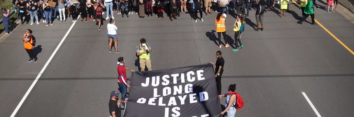 Demonstrators march down I-94 in St. Paul, Minnesota