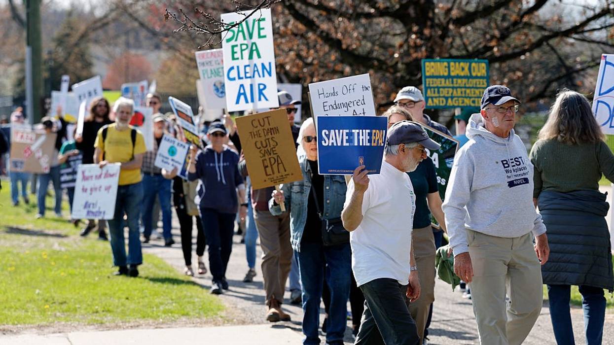 Demonstrators march during a "Hands off the EPA" rally