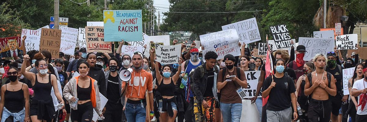 Demonstrators march in a Black Lives Matter 